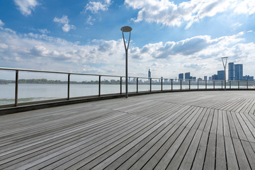 Fototapeta premium Panoramic skyline and modern business office buildings with empty road,empty concrete square floor