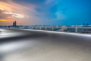 Panoramic skyline and modern business office buildings with empty road,empty concrete square floor