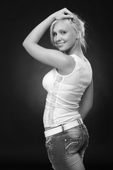 cute blonde woman wearing jeans and white top