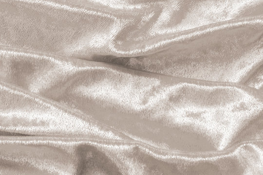 Beige gold velvet background or velour flannel texture made of cotton or wool with soft fluffy velvety satin fabric cloth metallic color material
