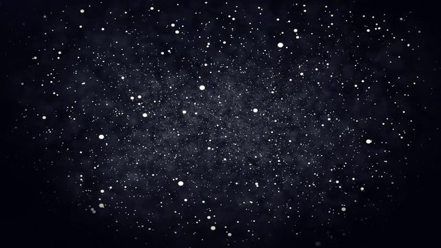 Particles floating on a dark background
