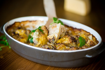 Cauliflower baked with meatballs in cheese sauce