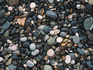 Naklejka premium Sea pebble on the beach. stones background.
