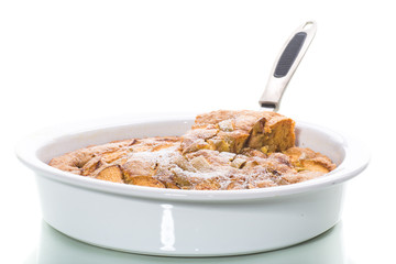 sweet apple pie in ceramic form on white