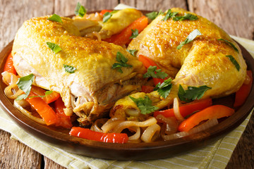 Golden chicken legs stewed with saffron close-up. Arabic cuisine. horizontal
