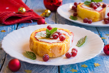 Cake with red berries on festive background