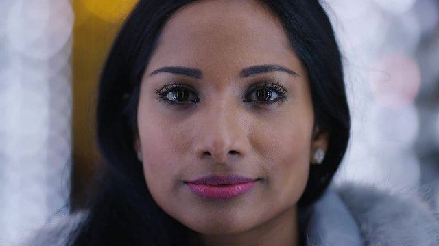 Portrait of young Indian female looking to camera