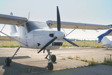 Fototapeta na wymiar Light single-engine aircraft at the airport