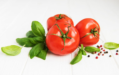 Fresh tomatoes with green basil