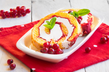Cake with cream, fresh fruit and mint
