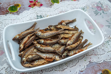 Home made food fried fish on large ceramic bowl