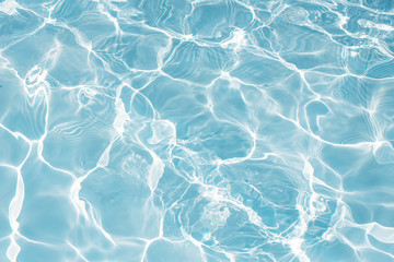 Texture of water in swimming pool for background