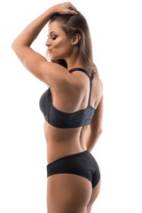 Obraz premium Tanned sexy girl in sports underwear rearview