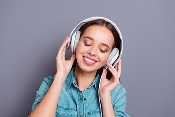 Fototapeta premium Close up portrait of attractive calm with closed eyes listening 