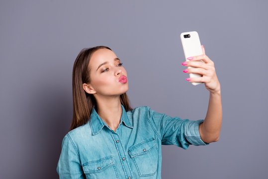 Close up portrait of taking selfie for boyfriend with kissing br
