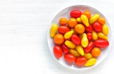 Plate with yellow and red tomatoes