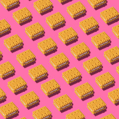 Creative art made with cookies pattern on pink background.
