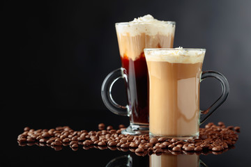 Various coffee drinks on a black background.