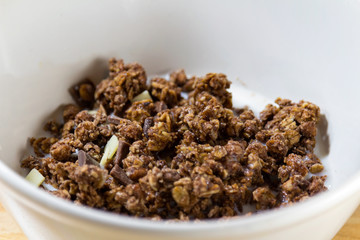 Chocolate corn flake with white and brown chocolate in white bowl