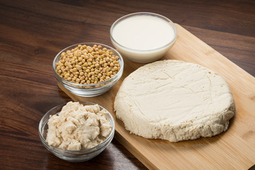 Food : Soy Milk, Soybeans, Okara and Tofu Isolated on Wooden Background