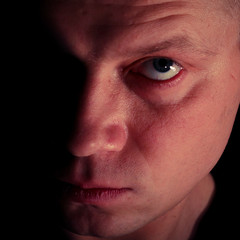 The man's portrait on a black background.