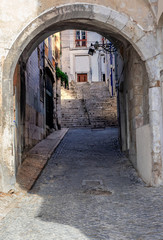 Lisbon - Portugal, access by a stone arch to the famous Alfama district