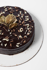 chocolate cake decorated with lemon and nuts