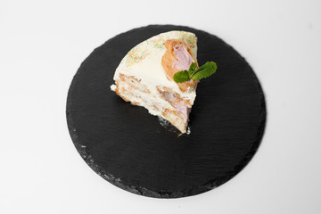 cake made of choux pastry decorated with mint 