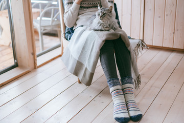 Girl relaxing with cat at home