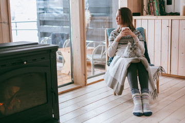 Girl relaxing with cat at home