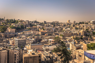 Fototapeta na wymiar Amman - September 29, 2018: View of central Amman from the Citadel viewpoint, Jordan
