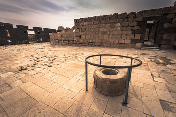 Naklejka premium Jordan - September 30, 2018: Ruins of an ancient castle in the dunes of the desert of Jordan