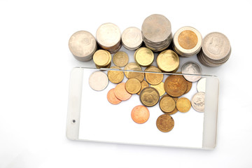 Mobile phone technology and coins on white background