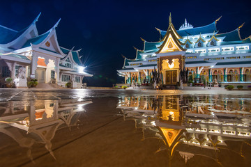 Thai temple beautiful at night twilight blue sky and light reflect on ground - Wat Pa Phu Kon Udon...
