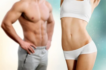 Athletic sport people standing and posing on green background