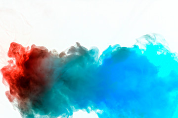 Dynamic puffs of blue gray and orange colors on a white background flow smoothly coloring waves rendering an isolated smoke pattern. Decorative wallpaper with multi-colored smoke.
