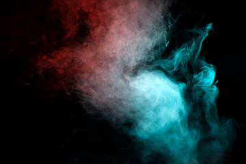 Translucent smoke rising to the top, illuminated by light on a dark background, multi-colored: blue, gray and red, evaporating in waves exhaled from the wape.