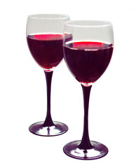 Two glasses of red wine on white