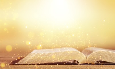 Holy bible book on wooden table