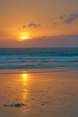 Spectacular sunset on the tropical ocean beach.