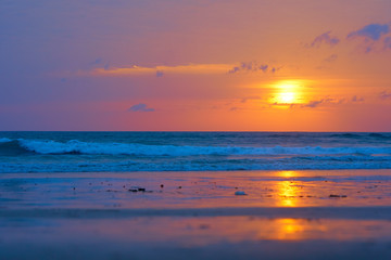 Spectacular sunset on the tropical ocean beach.