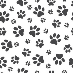 Fototapeta na wymiar Vector illustration animal paw track seamless pattern - backdrop with monochrome silhouettes of cat or dog footprint. Cute texture of black print of kitten or puppy trace shapes.