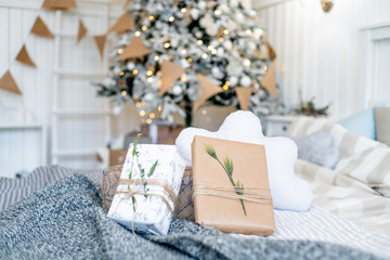 Christmas living room with a christmas tree and presents under it
