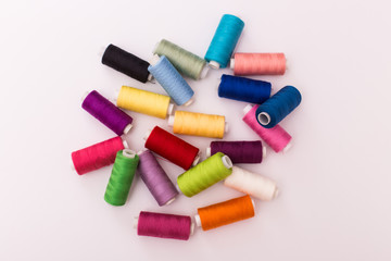 Colourful thread spools isolated on a white background