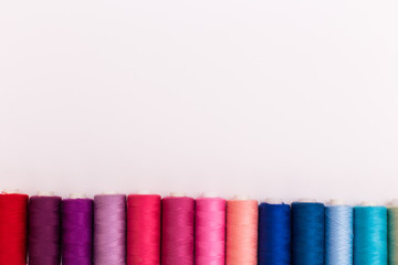 Colorful bobbins isolated on white background