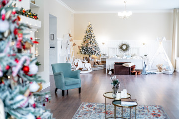 Christmas living room with a christmas tree and presents under it