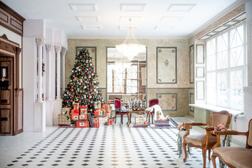 Christmas living room with a christmas tree and presents under it