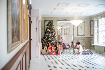 Christmas living room with a christmas tree and presents under it