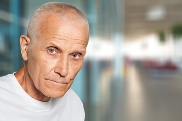 Thoughtful senior man at home