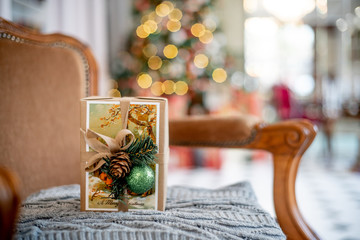 Christmas living room with a christmas tree and presents under it